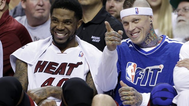 Miami Heat forward Udonis Haslem, left, and forward-center Chris Andersen chat on the bench during the second half of an NBA basketball game against the Detroit Pistons, Friday, Jan. 25, 2013 in Miami. The Heat defeated the Pistons 110-88. (AP Photo/Wilfredo Lee)
