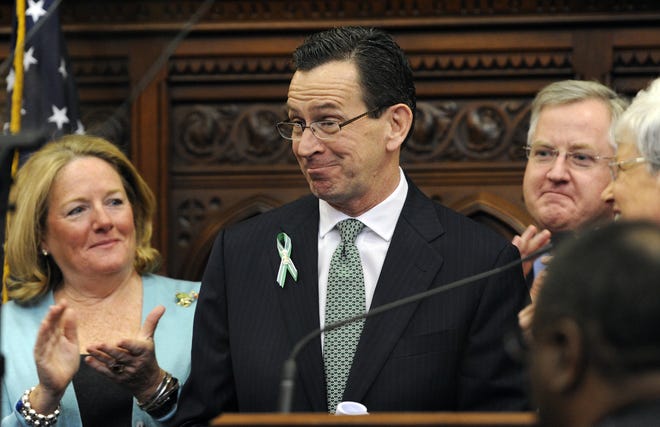 Gov. Dannel P. Malloy reacts after outlining his budget proposals for the next fiscal year Wednesday before the General Assembly at the Capitol in Hartford.