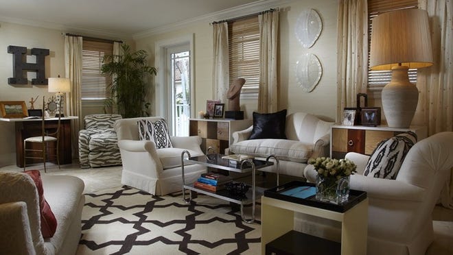 Various techniques, including a neutral palette, were used to make this 195-square-foot room look larger.