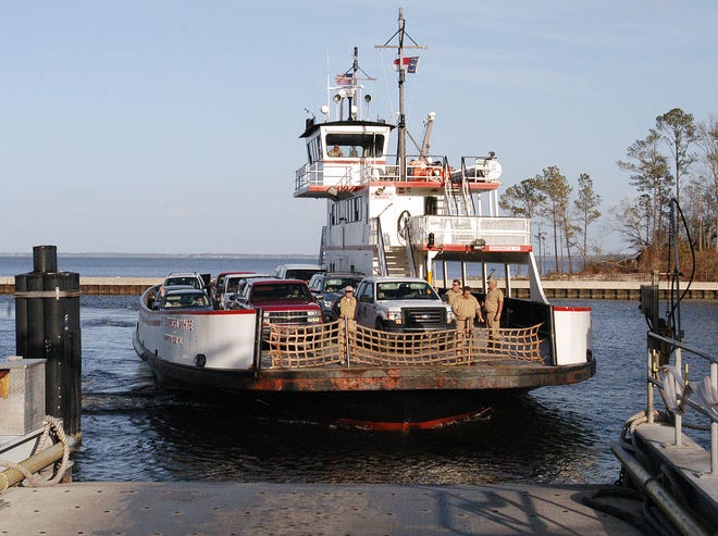 The Cherry Branch-Minnesott Beach ferry arrives at the dock. Legislation has been introduced to block the planned implementation of new tolls on the currently free ferry.
