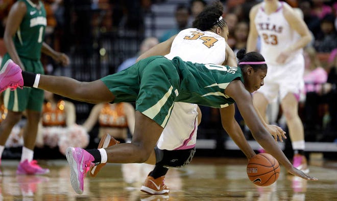 Baylor's Destiny Williams (10) and Texas' Imani McGee-Stafford (34) dive for a loose ball during the first half of an NCAA college basketball game, Saturday, Feb. 9, 2013, in Austin, Texas. (AP Photo/Eric Gay)