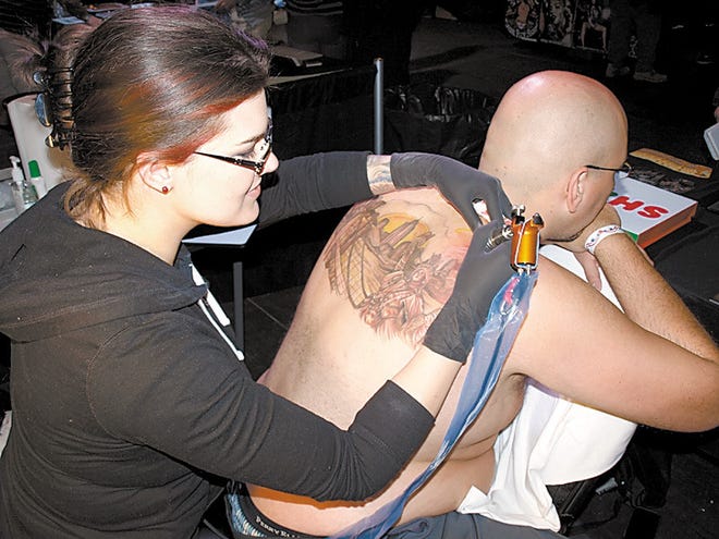 Spike TV's “Ink Master” runner-up Sarah Miller adds to Roman Pollack's tattoo. He was her first canvas on the show.