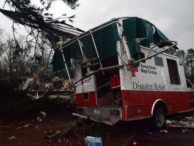 A trampoline rests on top of a damaged American Red Cross disaster relief truck outside of the Hattiesburg American Red Cross center which was completely destroyed by an apparent tornado that moved through Hattiesburg, Miss., Sunday, Feb. 10, 2013. (AP Photo/The Hattiesburg American, Bryant Hawkins)