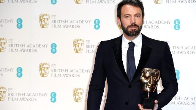 American actor and director Ben Affleck with the award for Best Film for “Argo,” at the BAFTA Film Awards at the Royal Opera House on Sunday, Feb. 10, 2013, in London.