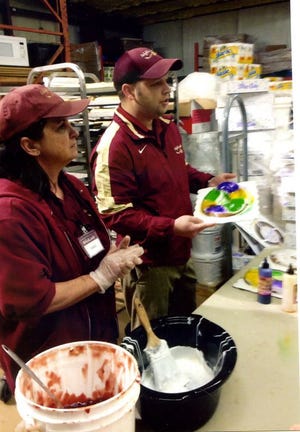 A Bizzy Bunch Preschool recently visited Ralph's Supermarket in Gonzales. From left, Carla Roddy and Brandon Troxclair show the students how King Cakes are made.