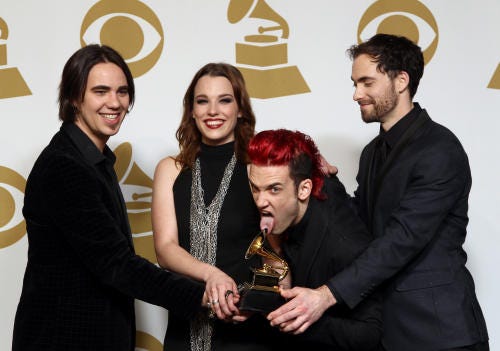Members of Halestorm, from left, Joe Hottinger, Lzzy Hale, Arejay Hale and Josh Smith celebrate their hard rock/metal Grammy backstage Sunday.