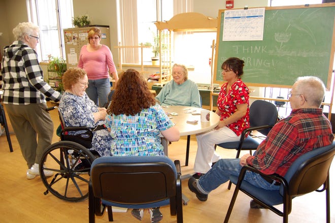 Legacy Club members play cards together Friday afternoon at Perennial Park. Standing are Peggy Hurd and Coordinator Melanie Hodos. Sitting around the table are Unice Taylor, Pat Pfeffer, Tammy Barker (Respite Care worker), Richard Patterson and Debbie Ryan (Respite Care worker). NANCY HASTINGS PHOTO