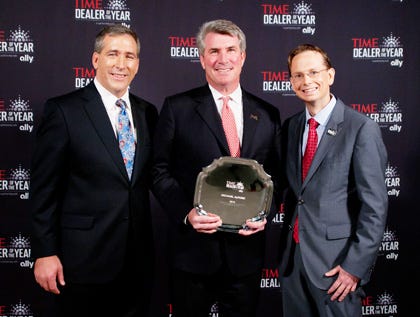 Jacksonville Marine Chevy owner Mike Alford, center, accepts the 2013 Time New Car Dealer of the Year award from Tim Russi, left, the president of Auto Finance at Ally Financial, and Brad Young, chief marketing officer at Time, during the 2013 National Automobile Dealers Association Convention held in Orlando, Fla.
