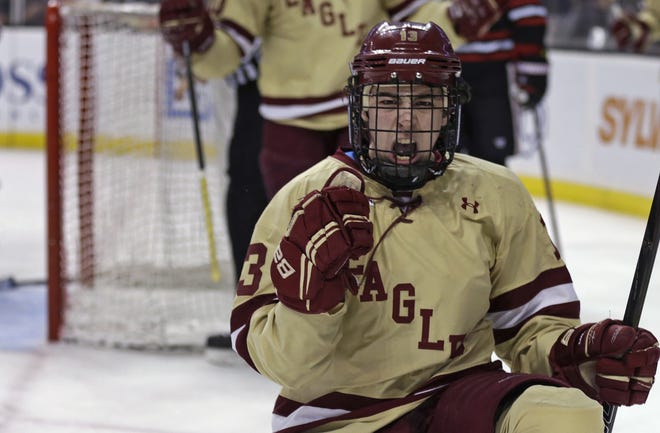 Boston College forward Johnny Gaudreau pumps his fist after scoring a goal during the second period of the Eagles' win over Northeastern in the championship game of the Beanpot college hockey tournament on Monday night.