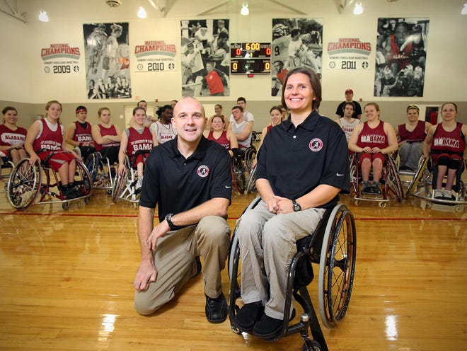 University of Alabama wheelchair basketball team coaches Brent Hardin, left, and Margaret Stran, who also started the program, are seen with the men's and women's teams at the UA recreation center on Feb. 7 in Tuscaloosa.