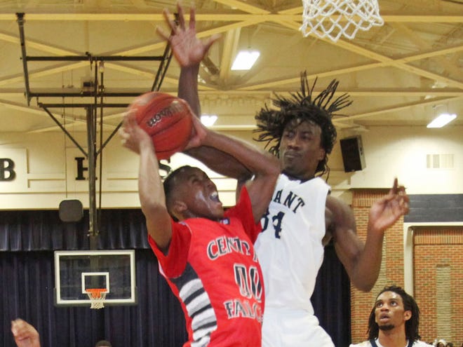 Paul W. Bryant’s Tony Whitehead (34) jumps to block a shot by Central’s Jevaris Richey (00) in the Class 5A, Area 7 tournament championship game at Paul W. Bryant High School on Monday.