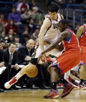 The Bucks' Ersan Ilyasova (left) steals the ball from the Sixers' Jrue Holiday during Milwaukee's 110-102 win on Jan. 22.