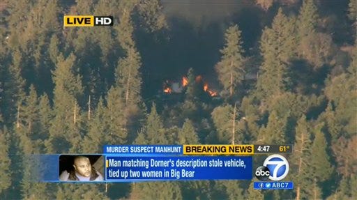 In this image, the cabin in Big Bear, Calif. where ex-Los Angeles police officer Christopher Dorner is believed to be barricaded inside is in flames Tuesday, Feb. 12, 2013.