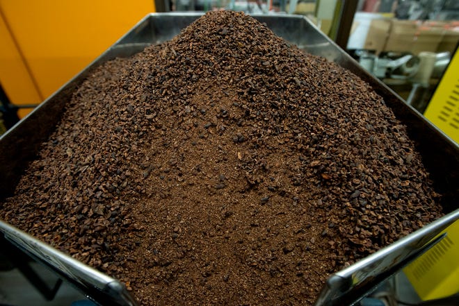 Cacao nibs are stone ground at the Taza chocolate factory.