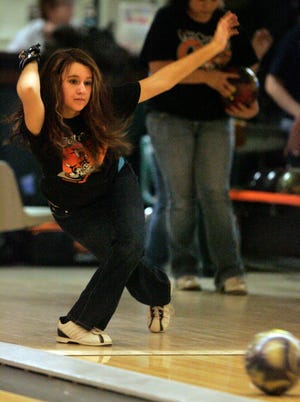 Lindsey Anderson rolls the ball down the lane Thursday, Nov. 17, 2011, during practice for Harlem High School's girls bowling team at Forest Hills Lanes in Loves Park.