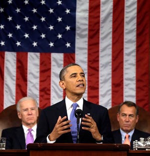 President Barack Obama, flanked by Vice President Joe Biden and House Speaker John Boehner of Ohio, gives his State of the Union address during a joint session of Congress on Capitol Hill in Washington on Tuesday.