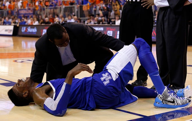 Kentucky's Nerlens Noel writhes in pain following a play during the second half against Florida at the Stephen C. O' Connell Center in Gainesville on Tuesday night.