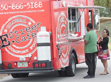 The E. Street Cafe food truck serves patrons at Carl Gray Park by Gulf Coast State College on Wednesday in Panama City.
