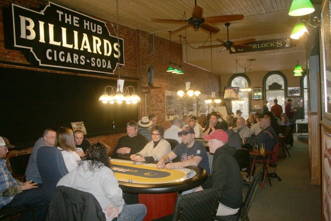 Poker players enjoy a Sunday tournament at The Hunt Club Charity Poker Room above The Hunt Club in Hillsdale. Players filled nearly four tables to play in the tournament with the profits benefitting the Reading Fire Department. MATT DURR PHOTO