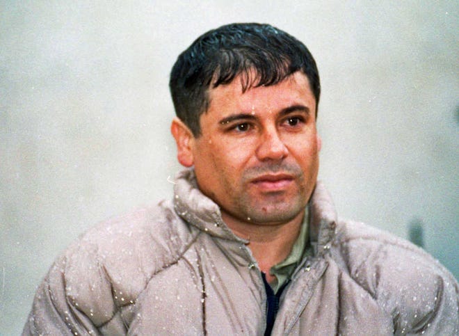 FILE - In this June 10, 1993 file photo, Joaquin Guzman Loera, alias "El Chapo" Guzman, is shown to the media after his arrest at the high security prison of Almoloya de Juarez, on the outskirts of Mexico City. Guzman escaped from a maximum security federal prison in 2001 and continues to be a fugitive. On Thursday, Feb. 14, 2013, the Chicago Crime Commission and the Drug Enforcement Administration is scheduled to name Guzman, the head of Mexico's Sinaloa crime cartel, as the new Public Enemy No. 1., the first time since Prohibition-era gangster Al Capone that authorities in the city deemed a crime figure so ominous a threat to deserve the label. (AP Photo/Damian Dovarganes, File)