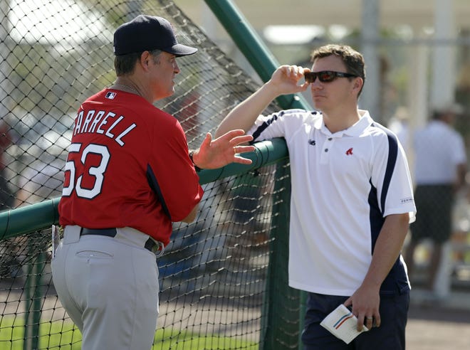 Boston Red Sox manager John Farrell, left, talks to general manager Ben Cherington after a team workout Wednesday, Feb. 13, 2013, in Fort Myers, Fla. (AP Photo/Chris O'Meara)