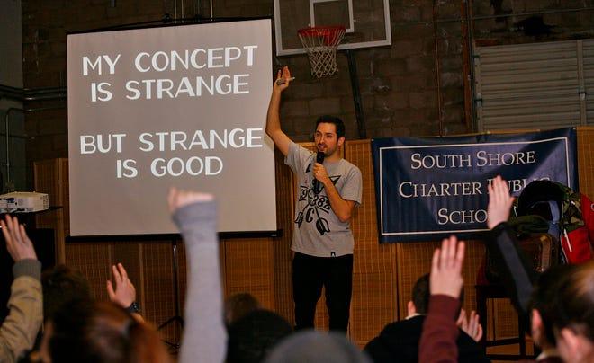 Johnny Earle speaking with students at the South Shore Charter Public School, Norwell about entrepreneurship. Earle is the founder of Johnny Cupcakes which he founded as a teenager in Hull working in his parents attic. Friday Feb. 15, 2013.