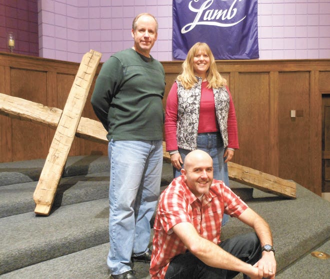 The Rev. Taylor Williams (seated), pastor of Whipple Heights C&MA Church in Perry Township, is donating space in his church to help shelter homeless men from the cold. The church is working in partnership with Refuge of Hope Ministries in Canton. With him is the Rev. Garth Crundwell, associate pastor, and member Denise Moore.