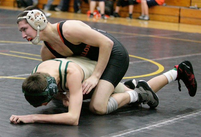 Massillon’s Jake Donahue (top) defeated GlenOak’s Conner Psaris with a pin Friday during the Division I sectional at Perry High School.