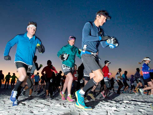 Participants in the 50 kilometer portion of the Destin 50 Beach Ultra competition take of from the starting line early Sunday morning on the beach behind Tops'l Beach Resort in South Walton County.