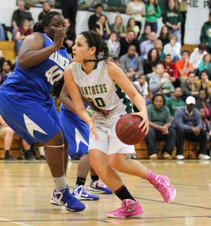 Nease's Olivia Bence drives the ball past Rickards' Shannon Owens Saturday during the second half of the Class 5A regional finals