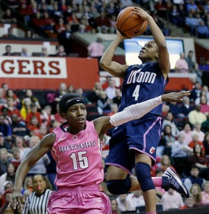 Connecticut's Moriah Jefferson (4) takes a shot over Rutgers' Syessence Davis (15) during the first half of an NCAA college basketball game Saturday, Feb. 16, 2013, in Piscataway, N.J. ()