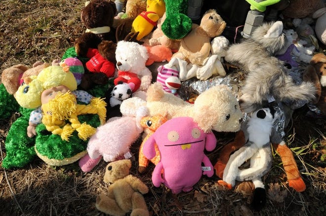 Stuffed animals and trinkets new and old are at a makeshift memorial at the intersection of Old York Road and Bordentown-Chesterfield Road in Chesterfield the day before the one-year anniversary of an accident that claimed the life of a 6th grader.