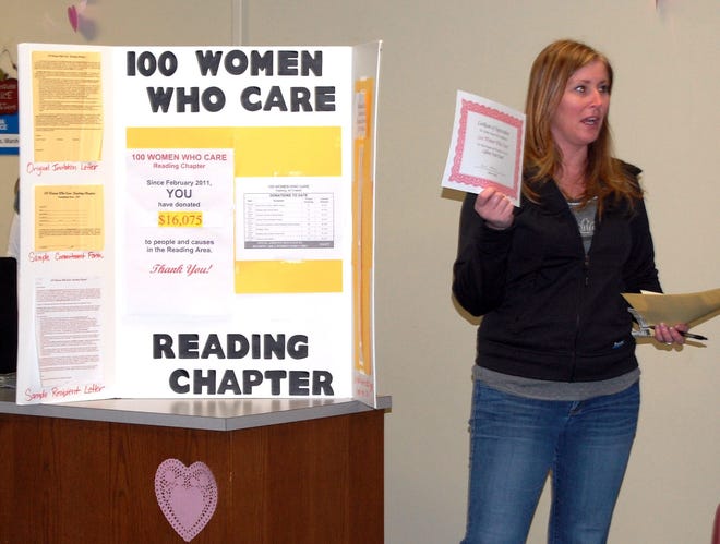 Anne Russo shows a certificate of appreciation from LifeLine Food Pantry presented to the Reading Chapter of 100 Women Who Care. NANCY HASTINGS PHOTO