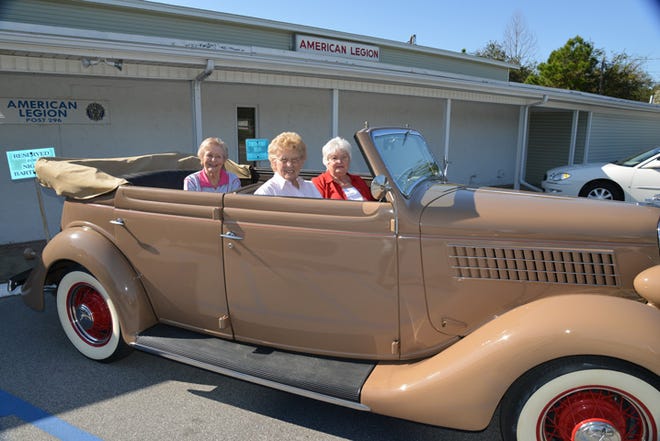 Destin residents Sarah Marshall (driver’s seat), Joanne Bourque (passenger seat) and Jeanne Pierce (backseat) smiled for pictures in a 1935 Ford convertible the day before their birthday party at The American Legion.