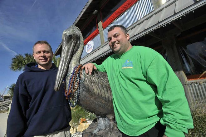 Will.Dickey@jacksonville.com Al Waldis (left) and T. J. Pelletier are owners of the Salty Pelican Bar & Grill in Fernandina Beach. Waldis said he and other downtown business owners feel cheated by the current commission.