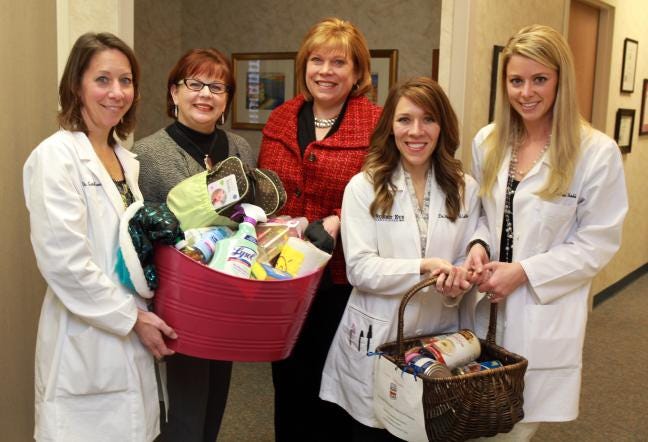 (Photo by Mike Hensdill/The Gaston Gazette) THe staff at Summit Eye in Gastonia are giving away items as part of their 10th anniversary. Here, (L-R) Sandra Farnham, Dar Finklestein, Ann Hoscheit, Meredith LeBlanc and Rachel Wruble. Photo taken at their office Monday afternoon, February 18, 2013.