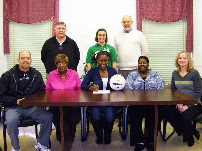 North Lenoir senior Deshona Cox (front center) has signed to play volleyball at Lenoir Community College in the fall. Pictured are, from left to right, front row: LCC assistant volleyball coach David Barnes, Evangeline Cox (grandmother), Deshona Cox, Melba Cox (mother) and LCC head volleyball coach Shelly Barnes; back row: North Lenoir Athletic Director Wayne Barwick, North Lenoir volleyball coach Heather Carson and North Lenoir Principal Gil Respess.