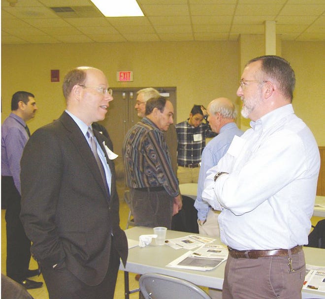 Paul Schemel, Wade Burkholder (center) and Brad Graham discussed Franklin County issues during a break at the Municipal Summit.