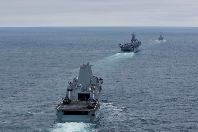 The amphibious transport dock ship USS San Antonio (LPD 17), the amphibious assault ship USS Kearsarge (LHD 3) and the guided-missile destroyer USS Roosevelt (DDG 80) sail in formation during a simulated strait transit. San Antonio and Kearsarge are participating in Composite Training Unit Exercise (COMPTUEX) off the East Coast of the U.S. in preparation for a deployment this spring.