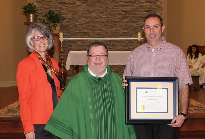 Andrew Bertrand was named the 2013 NCEA Catholic Elementary School Distinguished Graduate for St. Theresa Middle School on Jan. 29. Pictured (left to right): Chris Musso, principal; Father Gary Belsome, pastor at St. Theresa of Avila Church; and Andrew Bertrand, 2013 Distinguished Graduate.