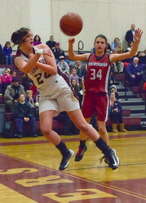 Algonquin’s Sarah Merchant (left) dives to keep the ball in play as Westborough’s Mia Natale covers her. The Tomahawks got the win in the Westborough Invitational.