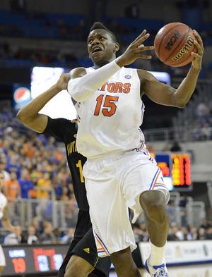 Florida Gators forward Will Yeguete (15) goes up for two points during the first half of an NCAA college basketball game against Southeastern Louisiana in Gainesville, Fla., Wednesday, Dec. 19, 2012. (AP Photo/Phil Sandlin)