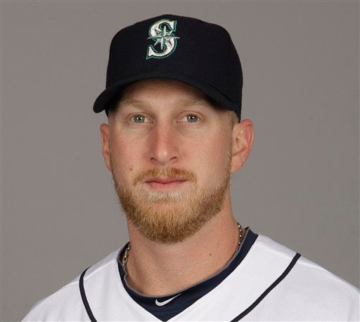 The Boston Red Sox acquire slugger Mike Carp from the Mariners for a player to be named later or cash.
