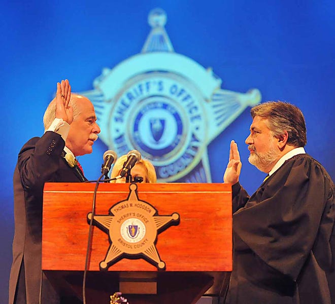 Sheriff Thomas Hodgson gets sworn in by Honorable Phillip Rapoza Chief Justice of the Massachusetts Appeals Court at Friedman Middle school Taunton.
Taunon Gazette