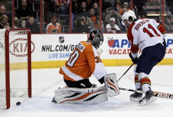 Florida's Jonathan Huberdeau scores on a penalty shot past Flyers goalie Ilya Bryzgalov during Thursday's game.