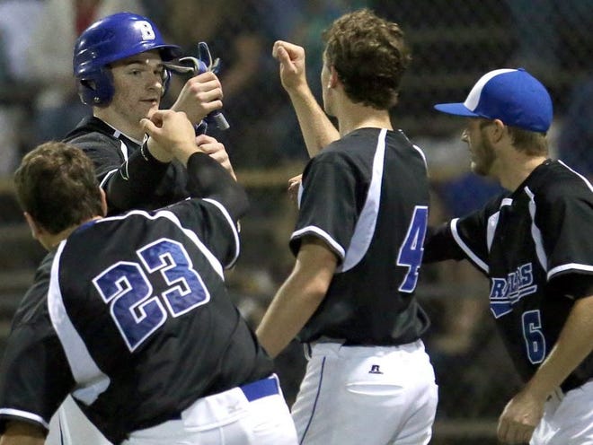 Belleview's David Haun (21) celebrates scoring a run against Palatka with his teammates during a baseball game at Belleview High School on Friday night.