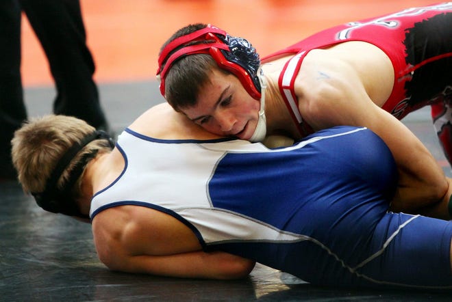 Jordan Paecht, top, of Holliston, has the advantage during a match in the Division 3 Sectional wrestling tournament last Saturday at Wayland. Paecht won the title at 120 pounds.