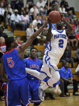 Will.Dickey@Jacksonville.com Ridgeview's Kenny Altieri (2) goes up for a twisting shot against Pensacola Pine Forest.