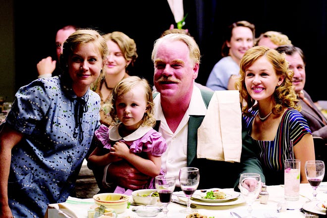 Amy Adams, left, and Philip Seymour Hoffman, center, in a scene from "The Master."