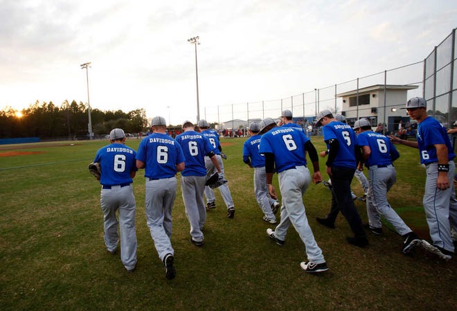 Wearing the number six in memory of former player Joe Davidson, the Bartram Trail baseball team takes the field during their game against Creekside at Bartram Trail High School on Thursday. By DARON DEAN, daron.dean@staugustine.com
